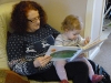 Teresa & Amelie, reading 'Very Hungry Caterpillar'