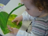 Amelie, reading 'Very Hungry Caterpillar'