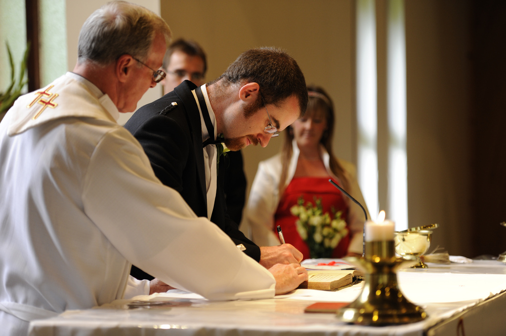 Luke signing the register